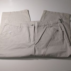 Tan capris with button detail at the cuff.